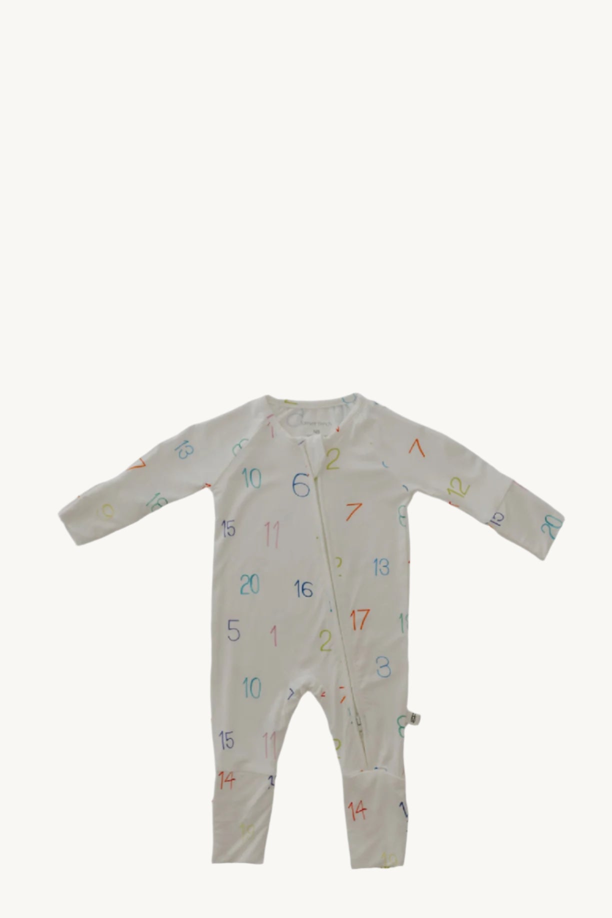 Baby onesie with colorful numbers and letters on a light gray background