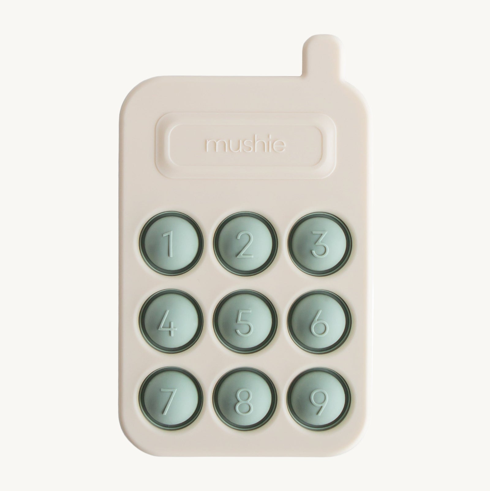 A soft silicone phone-shaped toy with numbered buttons in various shades of green and a BPA-free plastic frame.