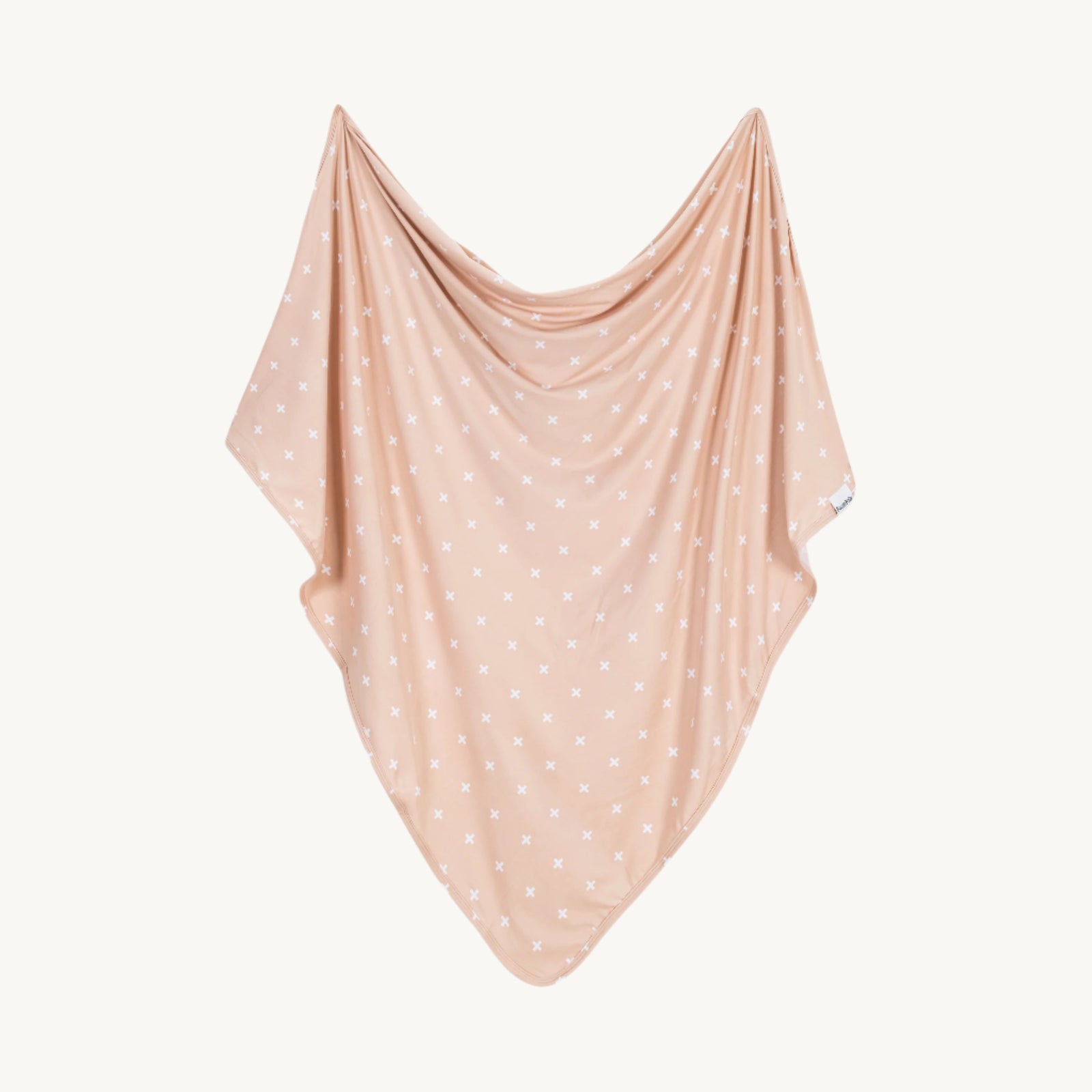 A mocha swaddle blanket with criss cross laid out flat.