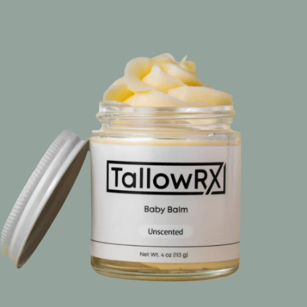 TallowRX baby balm jar with lid on a beige background
