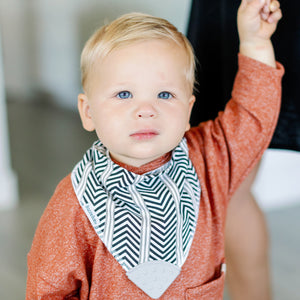 Baby wearing Bandana Drool Bib with Silicone Teether Attached