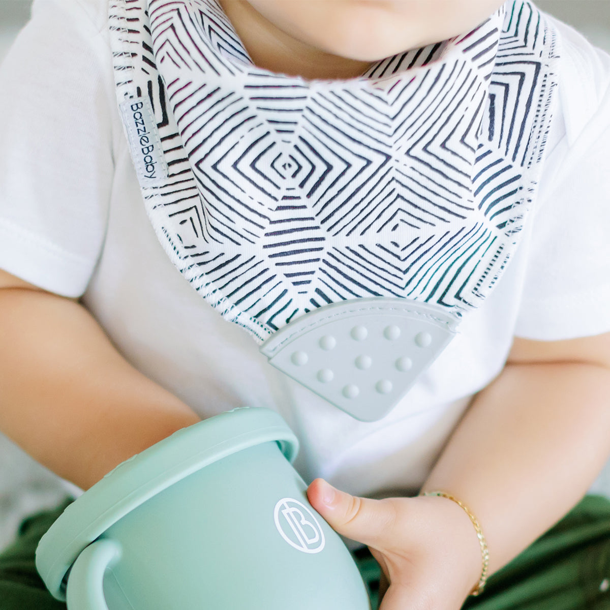 Baby wearing Bandana Drool Bib with Silicone Teether Attached