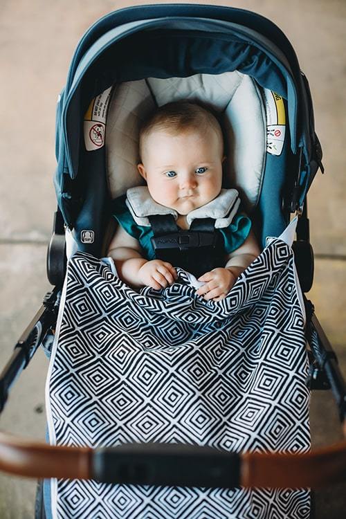 Wavy lines and hearts baby infinity scarf style drool bib and travel stroller blanket with clips.