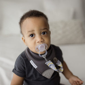 Bazzle Baby PaciLoop attached pacifiers and loveys to bib, clothing or carseats. Grey and yellow arrows.