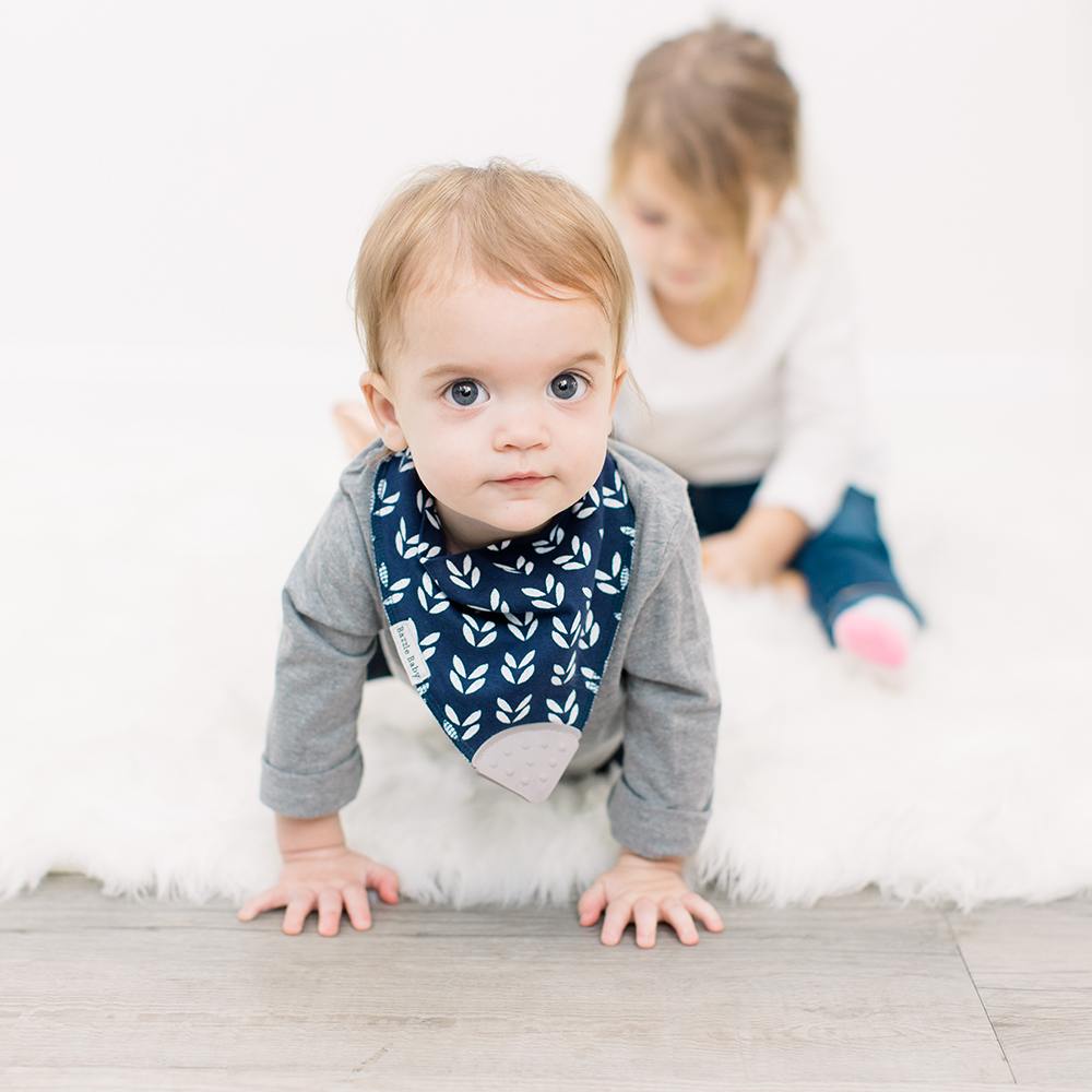 Baby wearing Bandana Drool Bib with Silicone Teether Attached