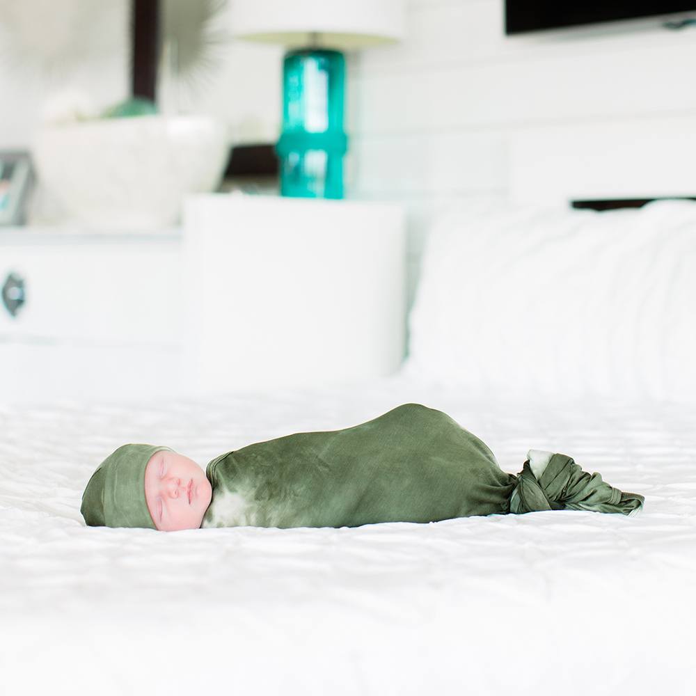 Bazzle Baby Forever Swaddle and Hat Set in olive tie-dye.