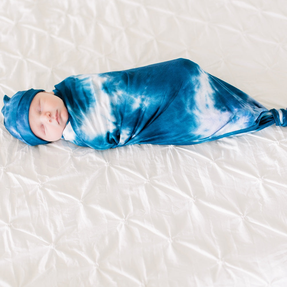 Bazzle Baby Forever Swaddle in navy tie-dye.