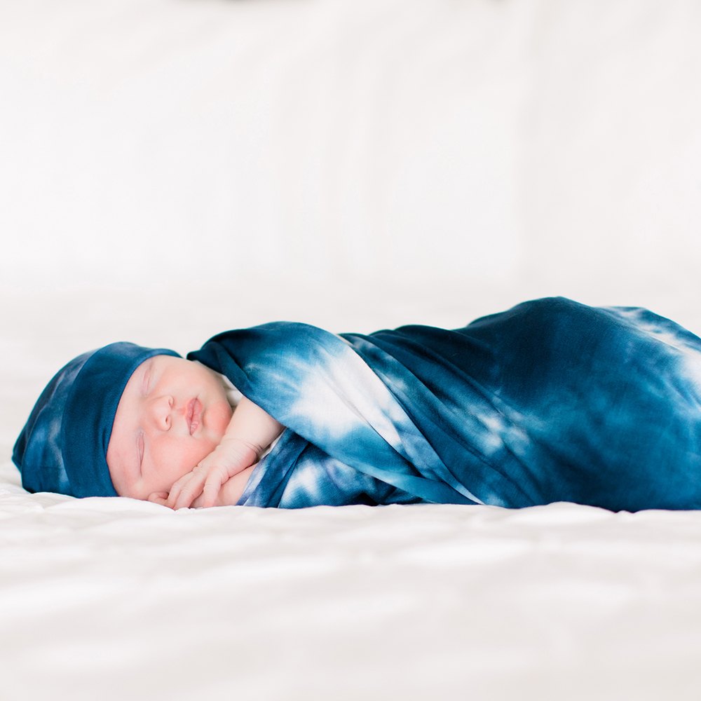 Bazzle Baby Forever Swaddle in navy tie-dye.