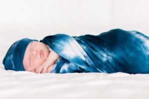 Bazzle Baby Forever Swaddle in navy tie-dye.
