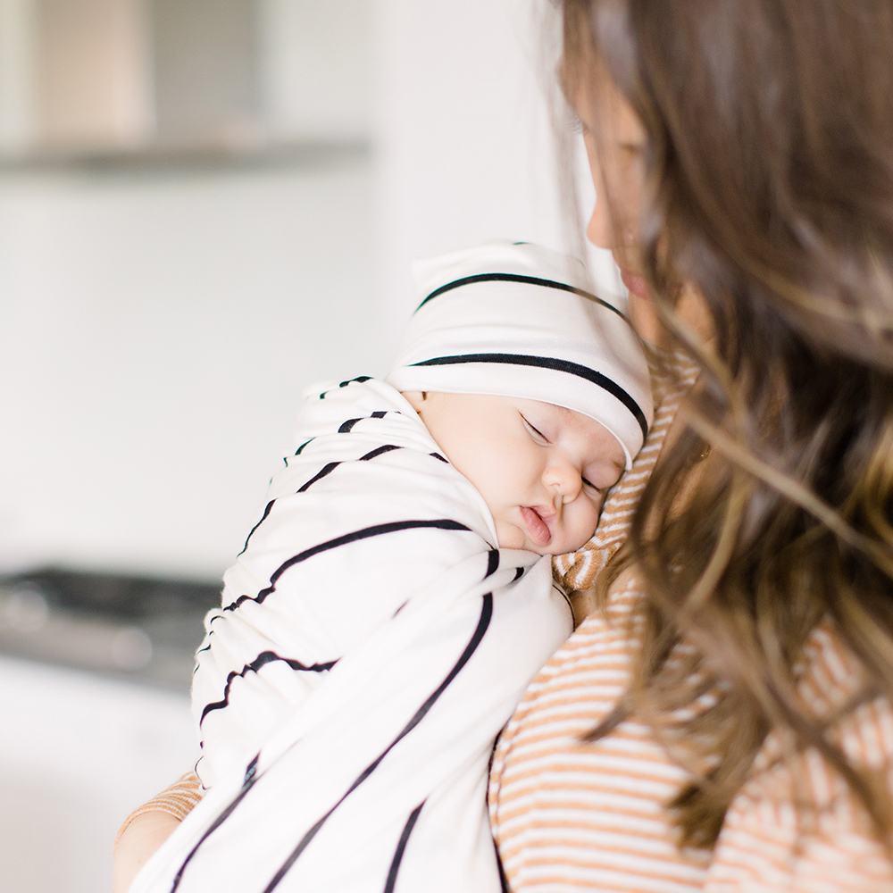 Bazzle Baby Forever Swaddle and Hat Set in classic black and white stripe.