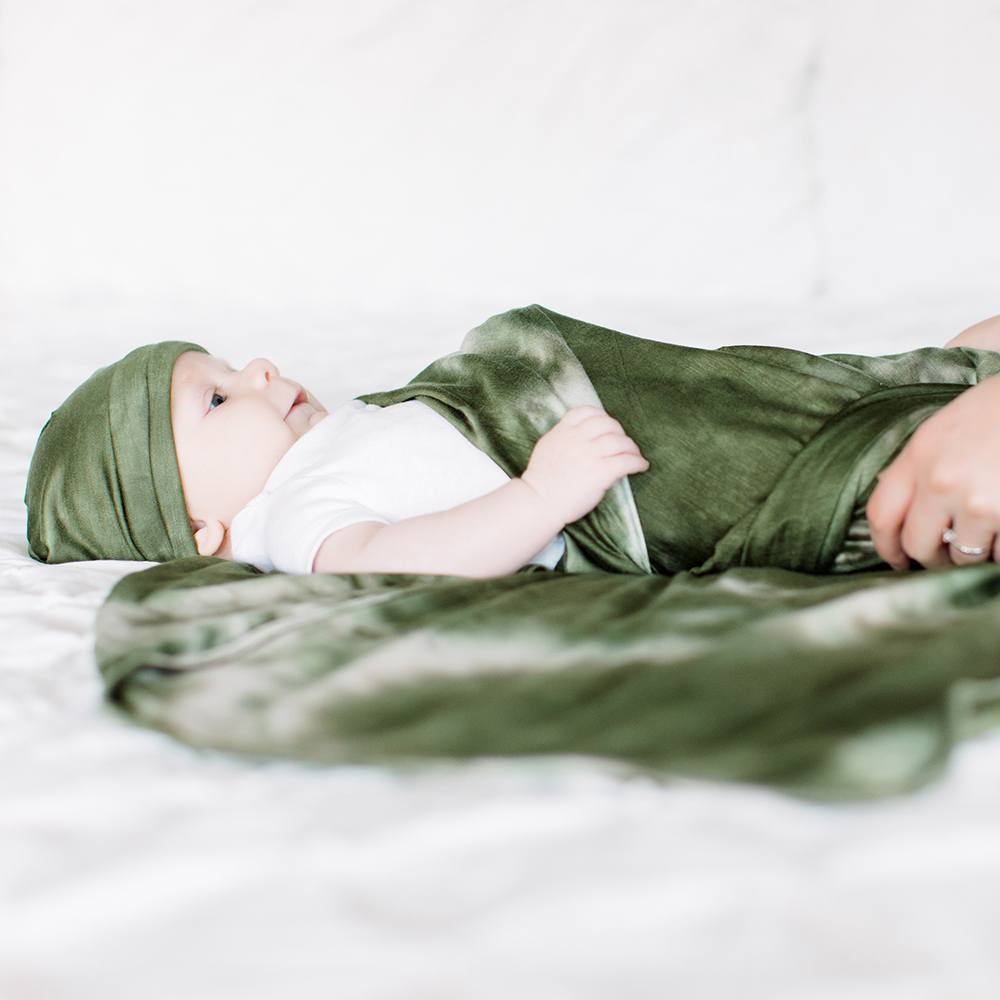 Bazzle Baby Forever Swaddle and Hat Set in olive tie-dye.