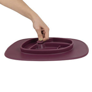 Bazzle Baby Anchor Silicone Mat in cranberry. Suctions to flat surfaces to not fall or slip.