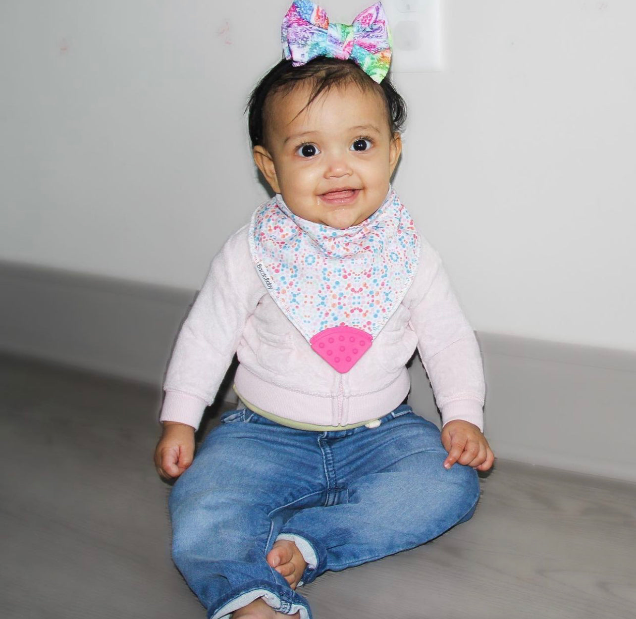 Baby wearing Bandana Drool Bib with Silicone Teether Attached