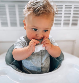 Baby wearing Bandana Drool Bib with Silicone Teether Attached