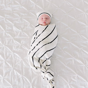 Bazzle Baby Forever Swaddle and Hat Set in classic black and white stripe.