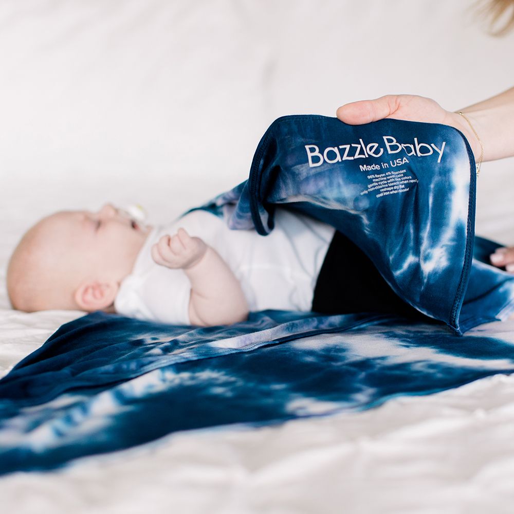 Bazzle Baby Forever Swaddle in navy tie-dye.