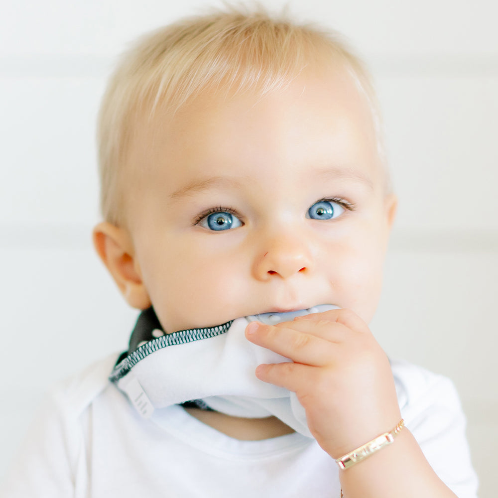Baby wearing Bandana Drool Bib with Silicone Teether Attached