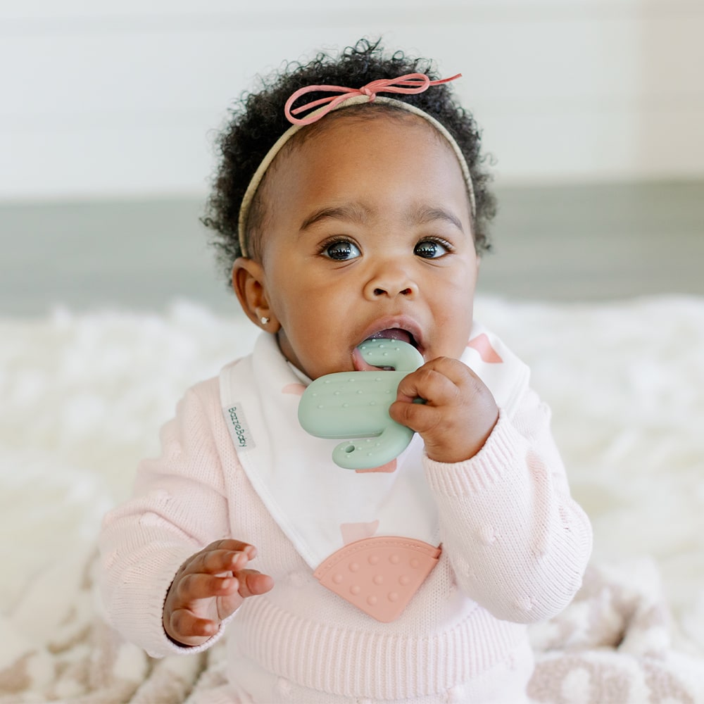 Baby wearing Bandana Drool Bib with Silicone Teether Attached